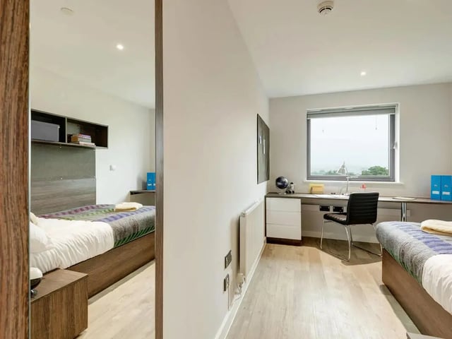 Bed desk chair and window bedroom at Cricket Field Court in Exeter Student Accommodation