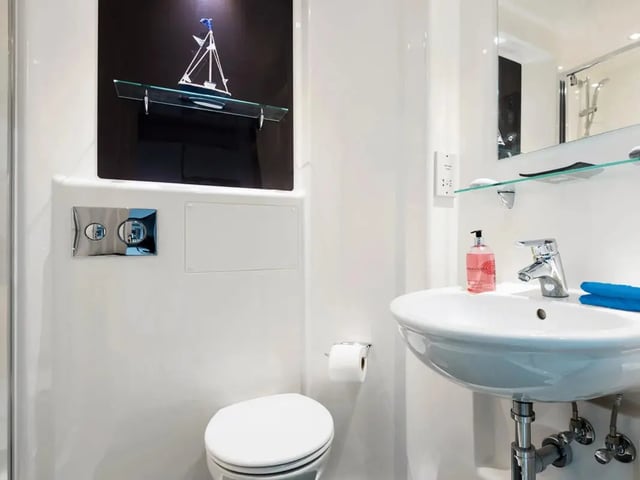 Toilet sink and picture of boat bathroom at Cricket Field Court in Exeter Student Accommodation