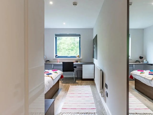 Two beds and a desk area bedroom at Cricket Field Court in Exeter Student Accommodation
