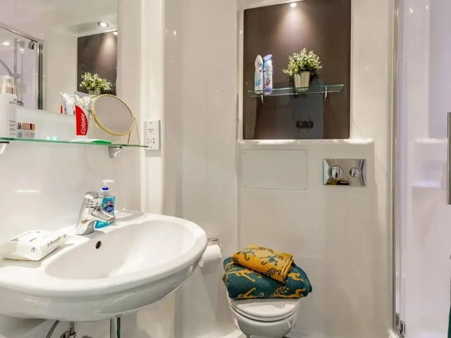 Sink soap towels and toilet bathroom at Cricket Field Court in Exeter Student Accommodation