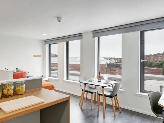 Dining table with chairs and jars living area at Dunaskin Mill in Glasgow Student Accommodation