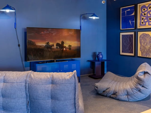 Blue living room with sofa TV and beanbag living room at The Brook in Bath Student Accommodation
