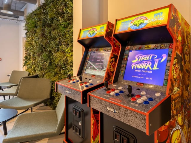 Arcade machines with Street Fighter game and chairs Playing Area at The Brook in Bath Student Accommodation