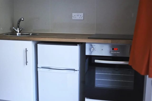 Sink fridge oven and cabinets kitchen at The Brook in Bath Student Accommodation