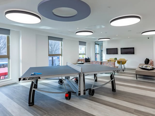 Ping pong table and TVs in communal living area at Pavilion Point in Brighton Student Accommodation