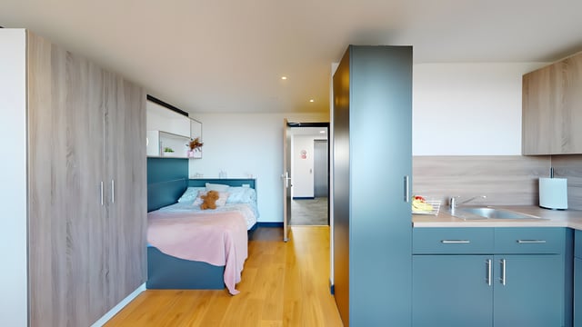 Bed kitchen cabinets and sink studio apartment at Innovo House in Liverpool Student Accommodation