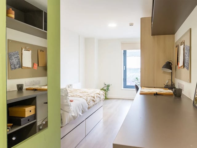 Bed desk and mirror student bedroom at Dun Holm House in Glasgow Student Accommodation