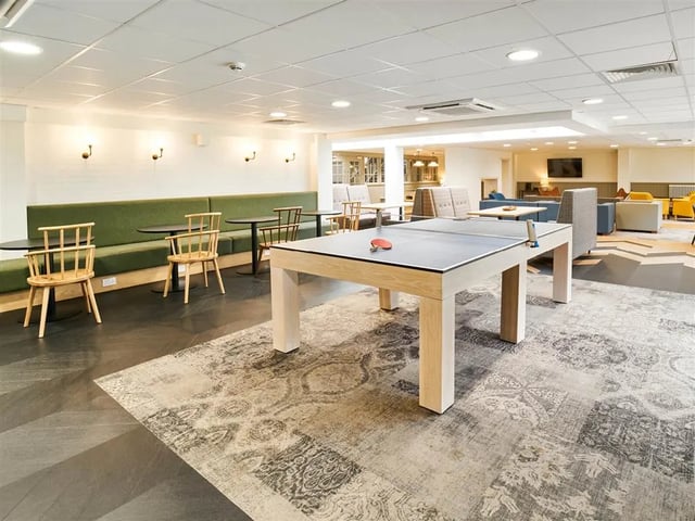 Ping pong table green bench seating lounge area at Dun Holm House in Glasgow Student Accommodation