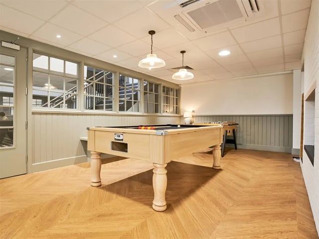 Pool table foosball table stairs gaming room at Dun Holm House in Glasgow Student Accommodation