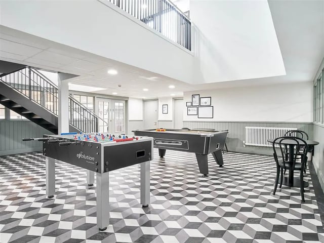 Foosball table pool table chairs table common room at Dun Holm House in Glasgow Student Accommodation