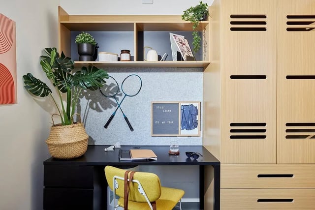 Desk with plant rackets and cabinet study area at Scape Queensberry in Melbourne Student Accommodation