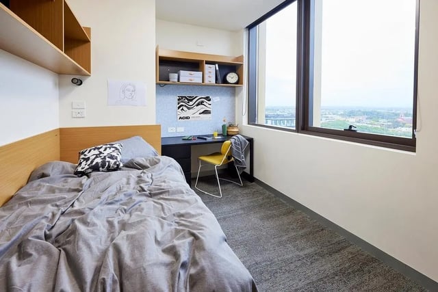 Bed desk shelves and window bedroom at Scape Queensberry in Melbourne Student Accommodation