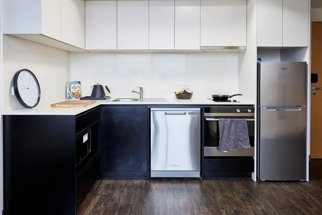 Clock kettle dishwasher oven fridge kitchen at Scape Queensberry in Melbourne Student Accommodation