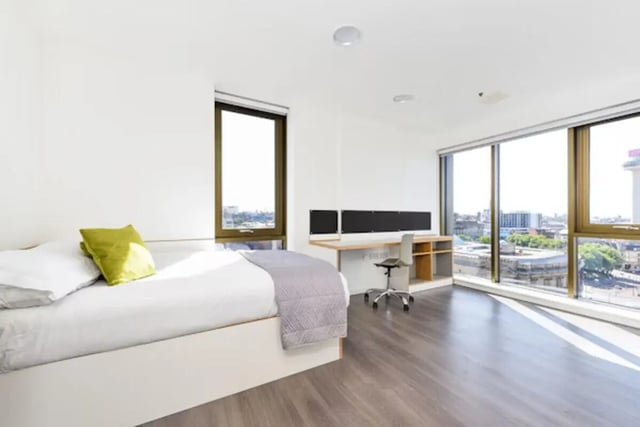 Bed desk chair with city view bedroom at Byrom Point in Liverpool Student Accommodation