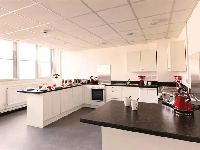 White cabinets oven toaster kettles kitchen at MyPad Paisley in Paisley Student Accommodation