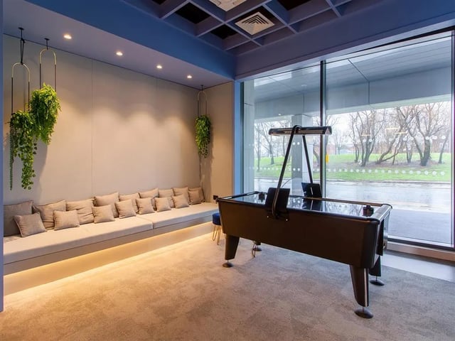 Air hockey table long sofa plush cushions playing area at Calico in Liverpool Student Accommodation