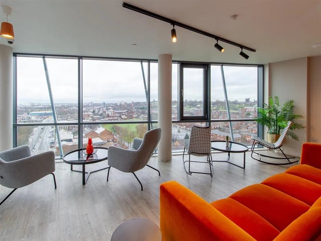 Comfortable armchairs and sofa with city view living room at Calico in Liverpool Student Accommodation
