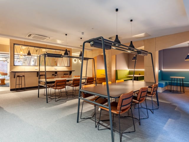 Modern communal tables and booths study area at Benson Yard in Liverpool Student Accommodation
