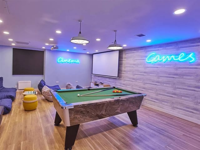 Pool table beanbags cinema and games room at New Orient House in London Student Accommodation
