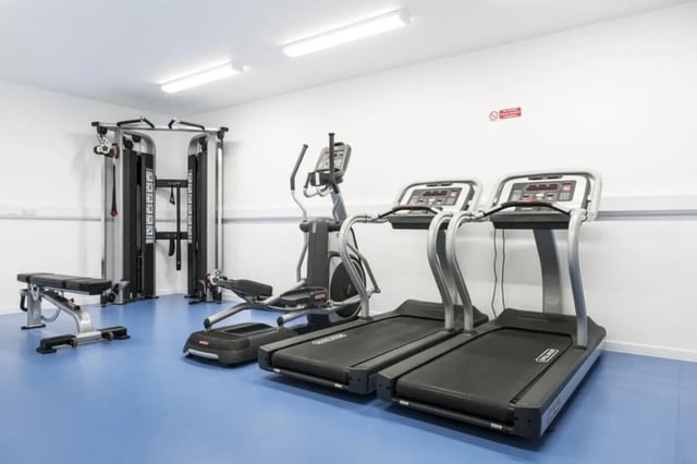 Gym equipment with treadmills and weight machine playing area at Prince Consort Village in London Student Accommodation