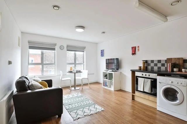 Sofa television dining table kitchen living room at Pavilion Court in Canterbury Student Accommodation