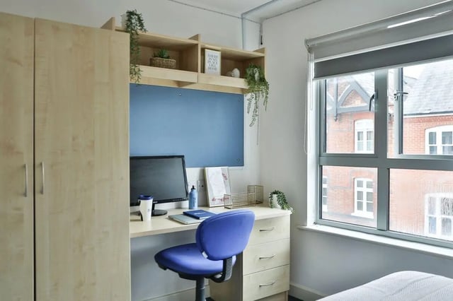 Wardrobe desk chair computer and window view study area at Pavilion Court in Canterbury Student Accommodation