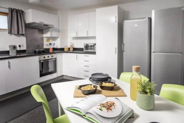 Kitchen with refrigerators oven and table kitchen at Fitzroy Court in Luton Student Accommodation