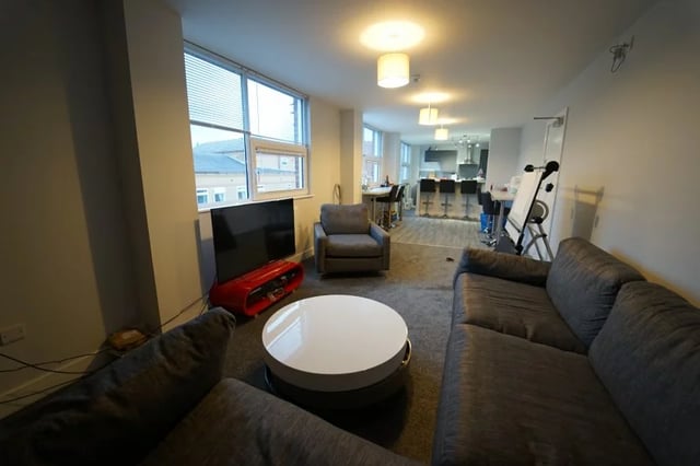 Sofa tv coffee table and chairs living room at Middle Street - Nottingham in Nottingham Student Accommodation