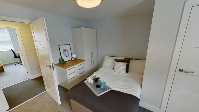 Bed wardrobe dresser tray and nearby study area bedroom at Middle Street - Nottingham in Nottingham Student Accommodation