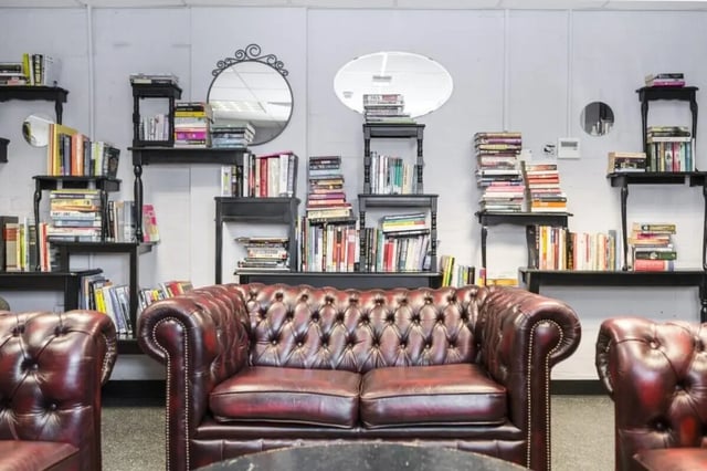 Chesterfield sofas and bookshelves living room at John Lester and Eddie Colman Courts in Salford Student Accommodation