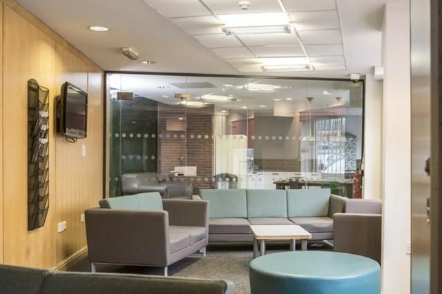Sofa and coffee table in a communal area. at John Lester and Eddie Colman Courts in Salford Student Accommodation