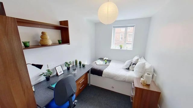 Desk bed lamp and decorative baskets bedroom at 6 Albert Square in Nottingham Student Accommodation