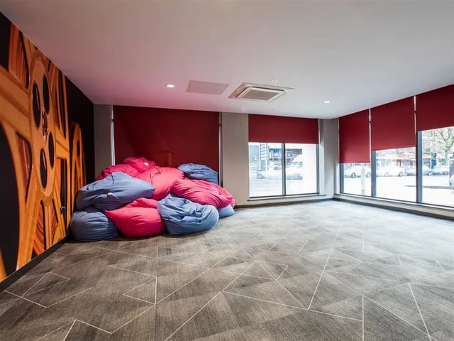 Beanbags on carpet floor with large windows Living room at Botanic Studios in Belfast Student Accommodation