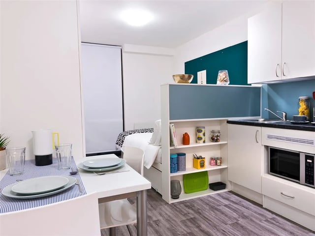 Bed kitchen dining table study area studio at Botanic Studios in Belfast Student Accommodation
