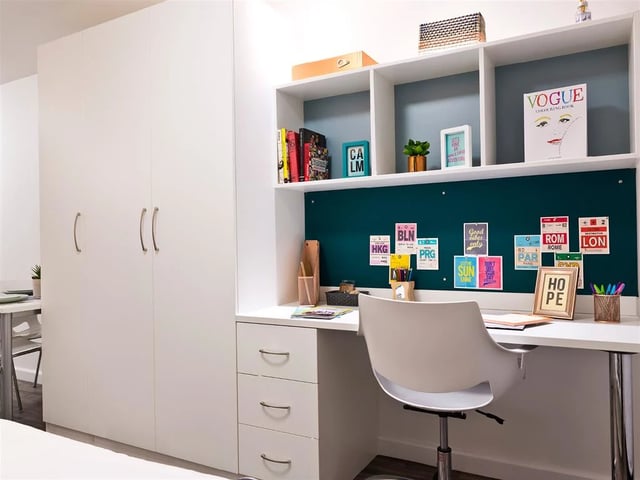 White wardrobe desk chair with colorful pins study area at Botanic Studios in Belfast Student Accommodation