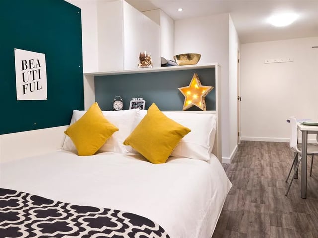 Bed with yellow pillows and star light bedroom at Botanic Studios in Belfast Student Accommodation