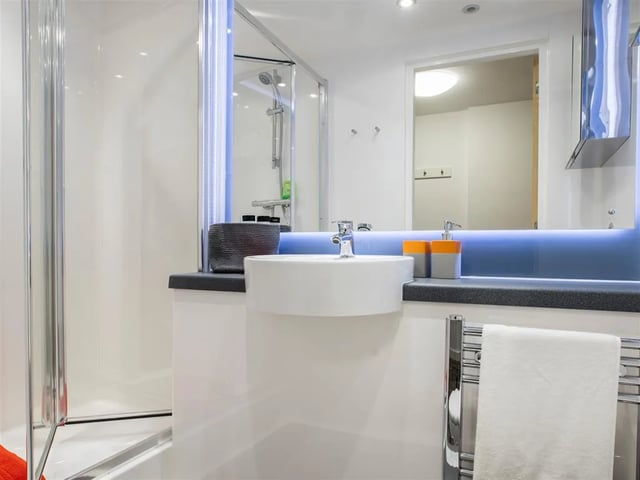 Modern bathroom with sink shower and towel rack bathroom at Botanic Studios in Belfast Student Accommodation