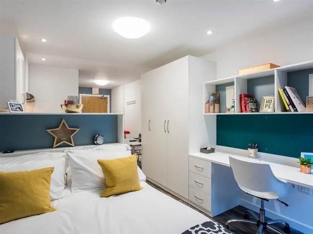 Bed desk wardrobe shelving study area bedroom at Botanic Studios in Belfast Student Accommodation