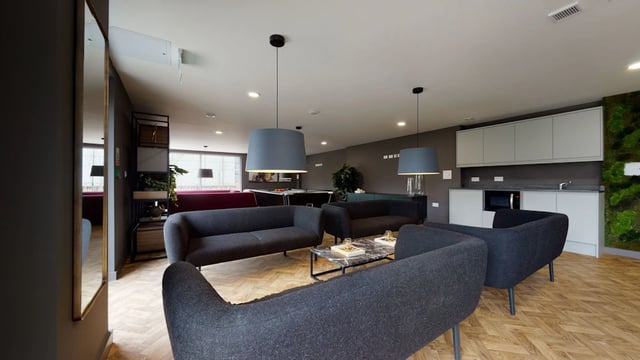 Modern sofas and kitchen area living room at One London Road in Newcastle Under Lyme Student Accommodation