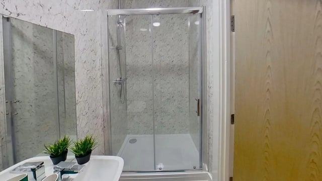 Shower cubicle sink mirror plants bathroom at Dojo House Nottingham in Nottingham Student Accommodation