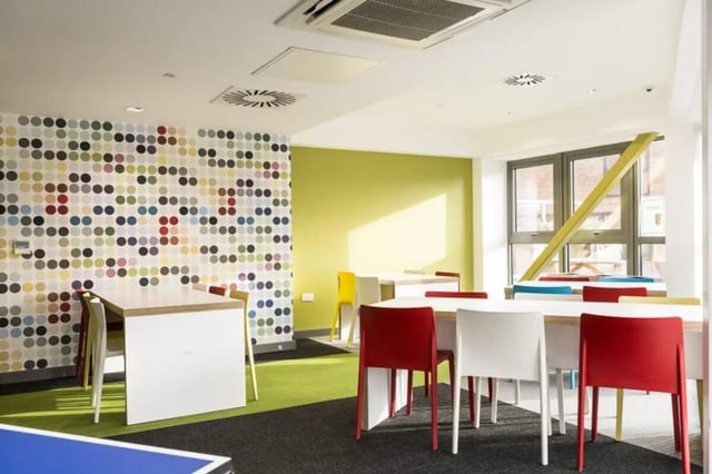 Colorful dotted wall tables and chairs common area at Peel Park Quarter in Salford Student Accommodation