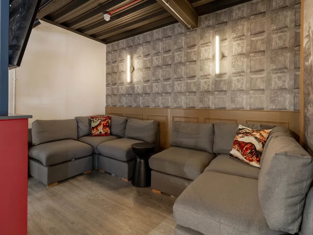 Gray sectional sofas with decorative pillows living room at Truro Sheffield in Sheffield Student Accommodation