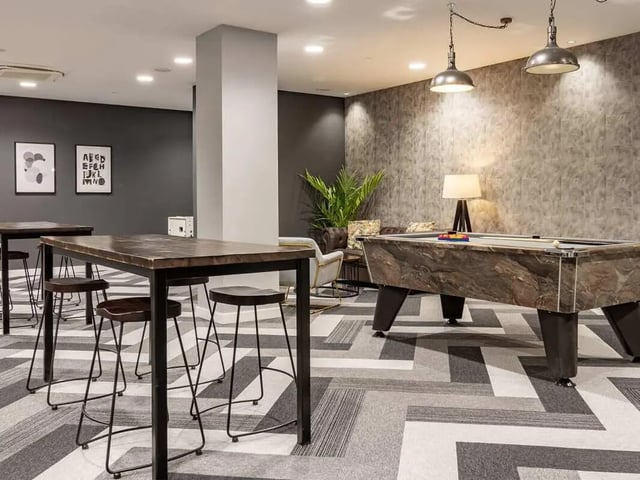 Pool table bar tables and stools communal room at The Gate in Sheffield Student Accommodation