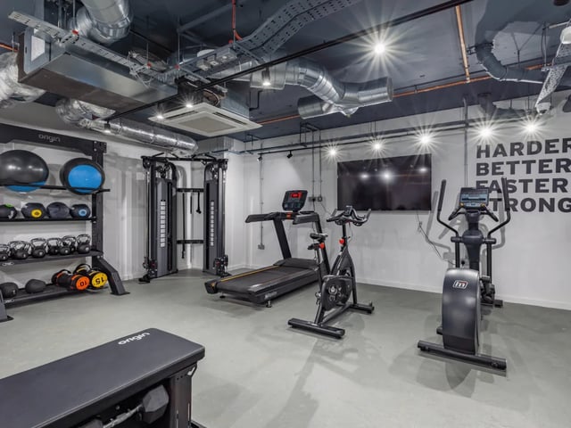 Gym equipment with treadmills exercise bikes and weights gymnasium at Ty Nant in Swansea Student Accommodation