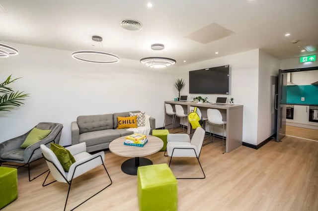 Sofa chairs table with board game living room at Crosstrend House in Lincoln Student Accommodation