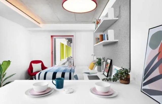 Bed desk chair and dining setting bedroom at Scape Guildford in Guildford Student Accommodation
