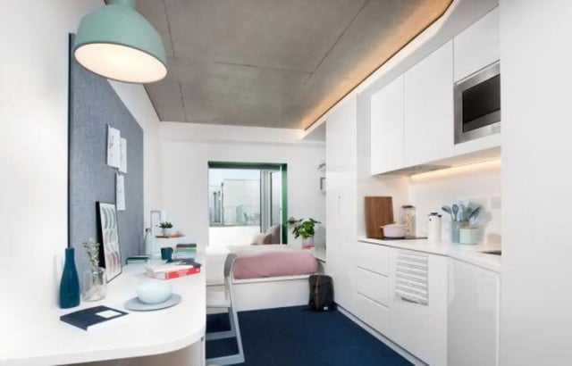 Desk bed kitchen area with microwave studio apartment at Scape Guildford in Guildford Student Accommodation