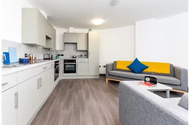 Modern kitchen with sofa living room at Swanston House in Belfast Student Accommodation