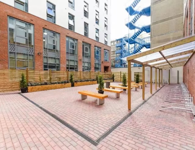 Wooden benches and bike racks outdoor area exterior at Swanston House in Belfast Student Accommodation