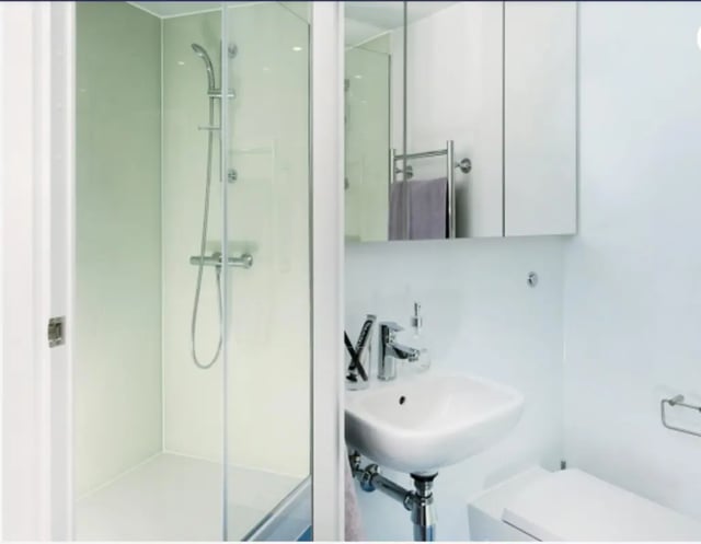 Shower sink toilet cabinet mirror bathroom at Scape Bloomsbury in London Student Accommodation